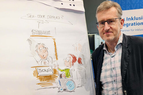 Cartoonist Phil Hubbe zeichnete live auf der REHAB.